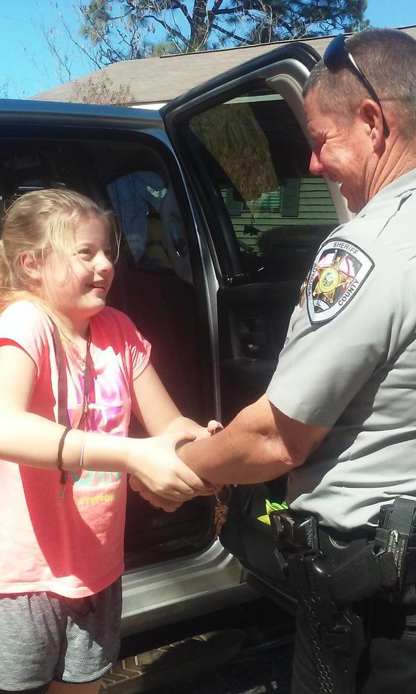 Girl Handcuffing Lt. Adams