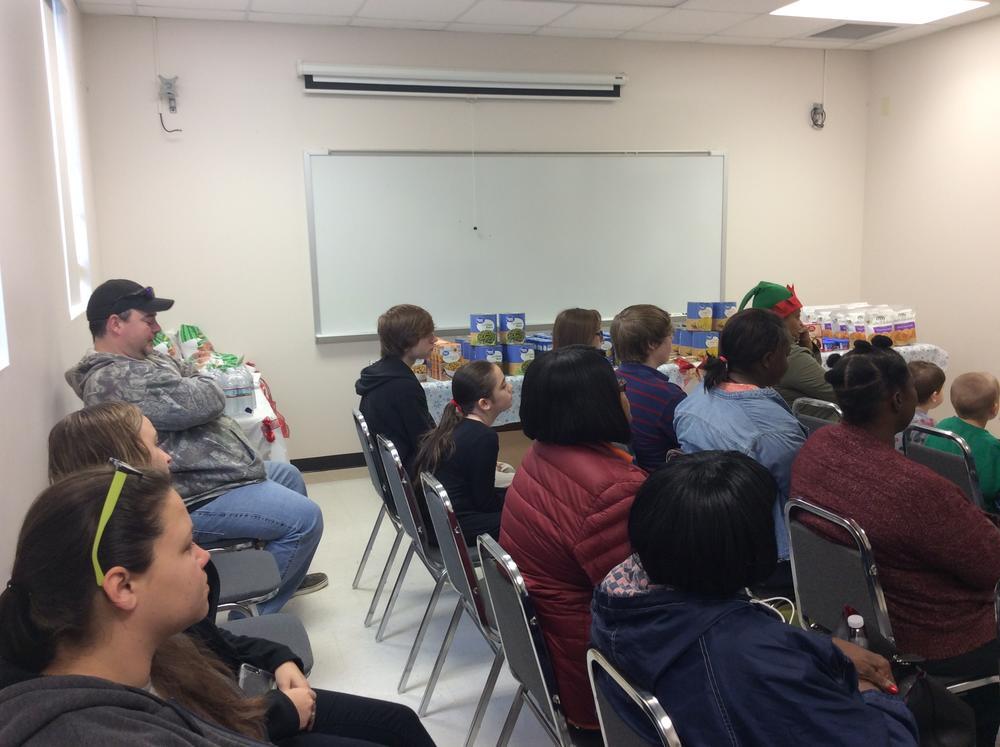 Families gathered to receive Christmas meal